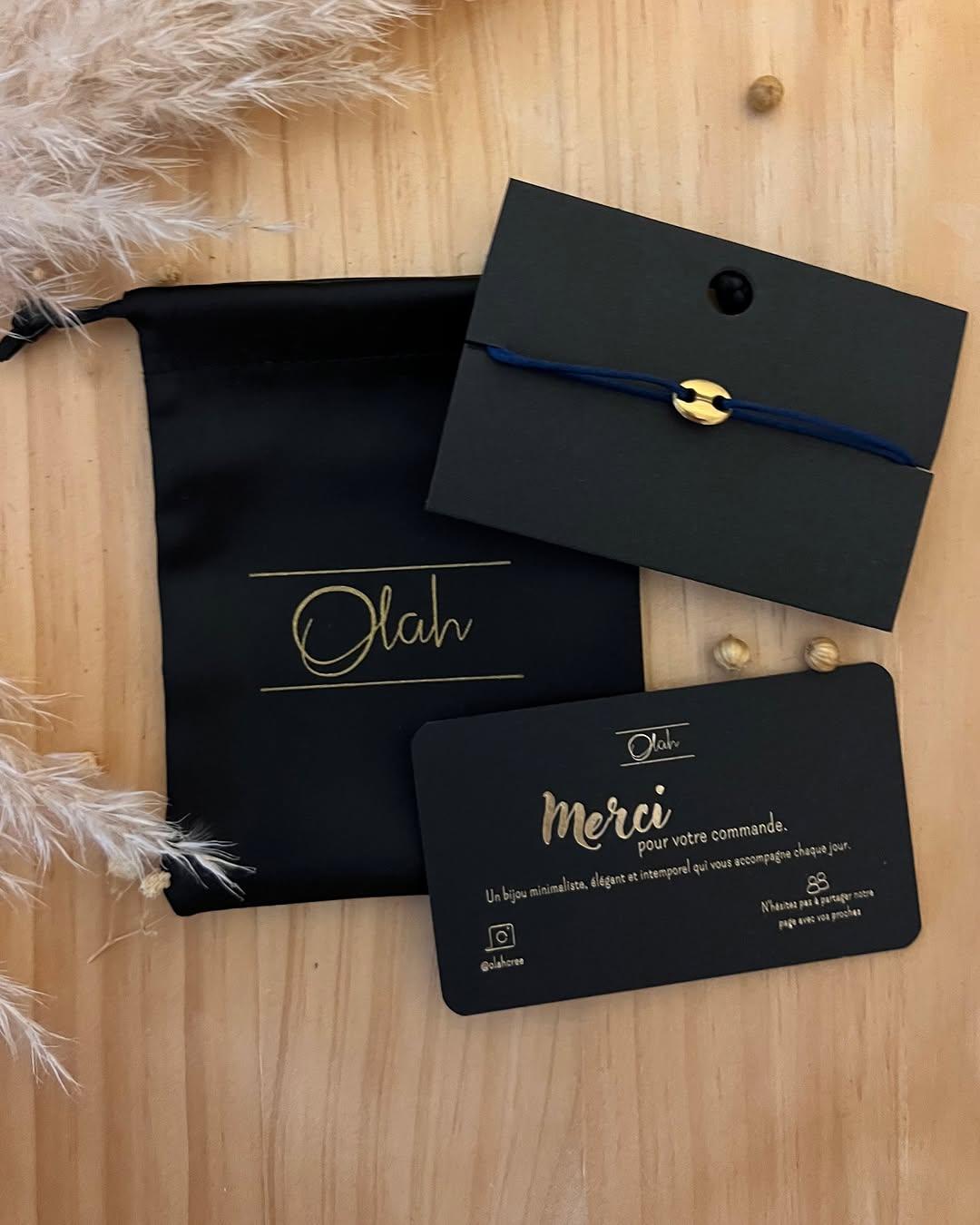 Pochette noire Olah et bracelet café doré